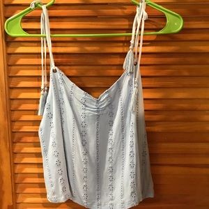 Light blue crop with double straps and tassels